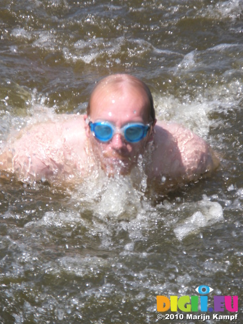 JT00984 Marijn attempting butterfly stroke in lake 'De Fluezen' from Indijk, The Netherlands